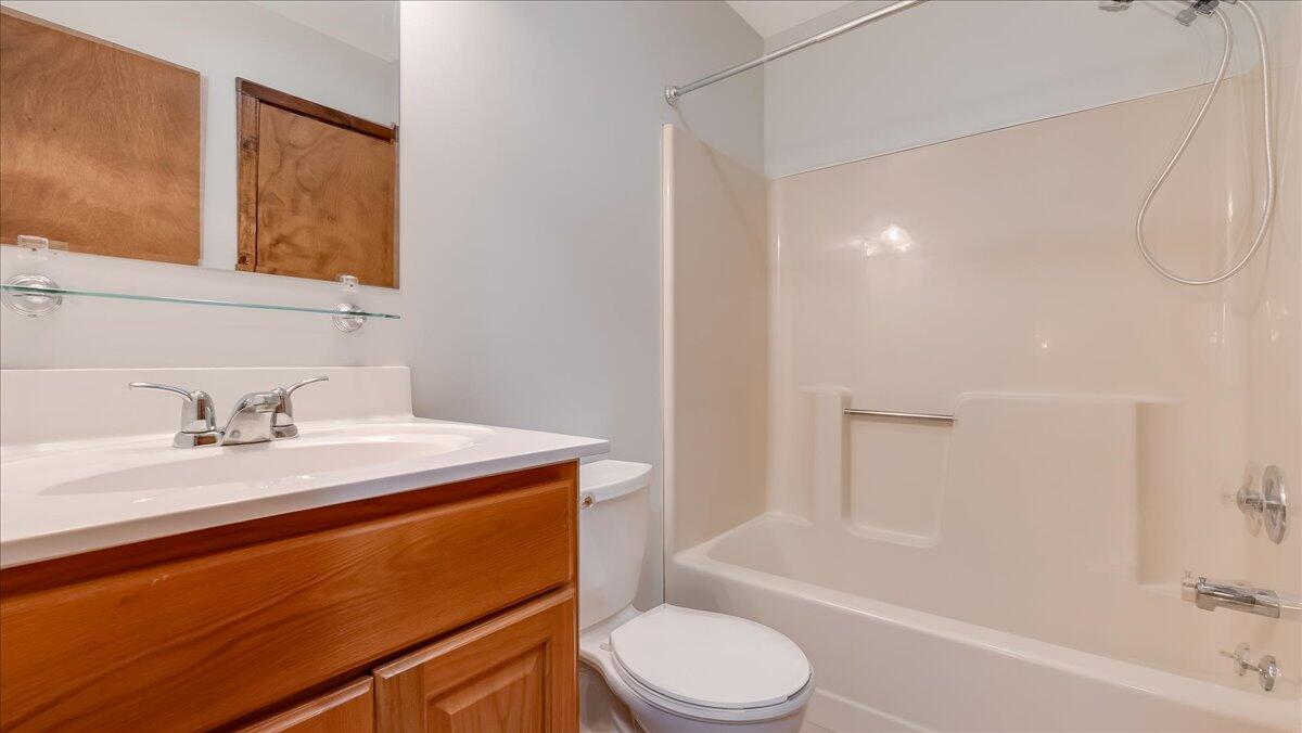 5913 Decker Road Bushkill, PA 18324 - Photo 34 of 53 a bathroom with a granite countertop sink toilet mirror vanity and bathtub