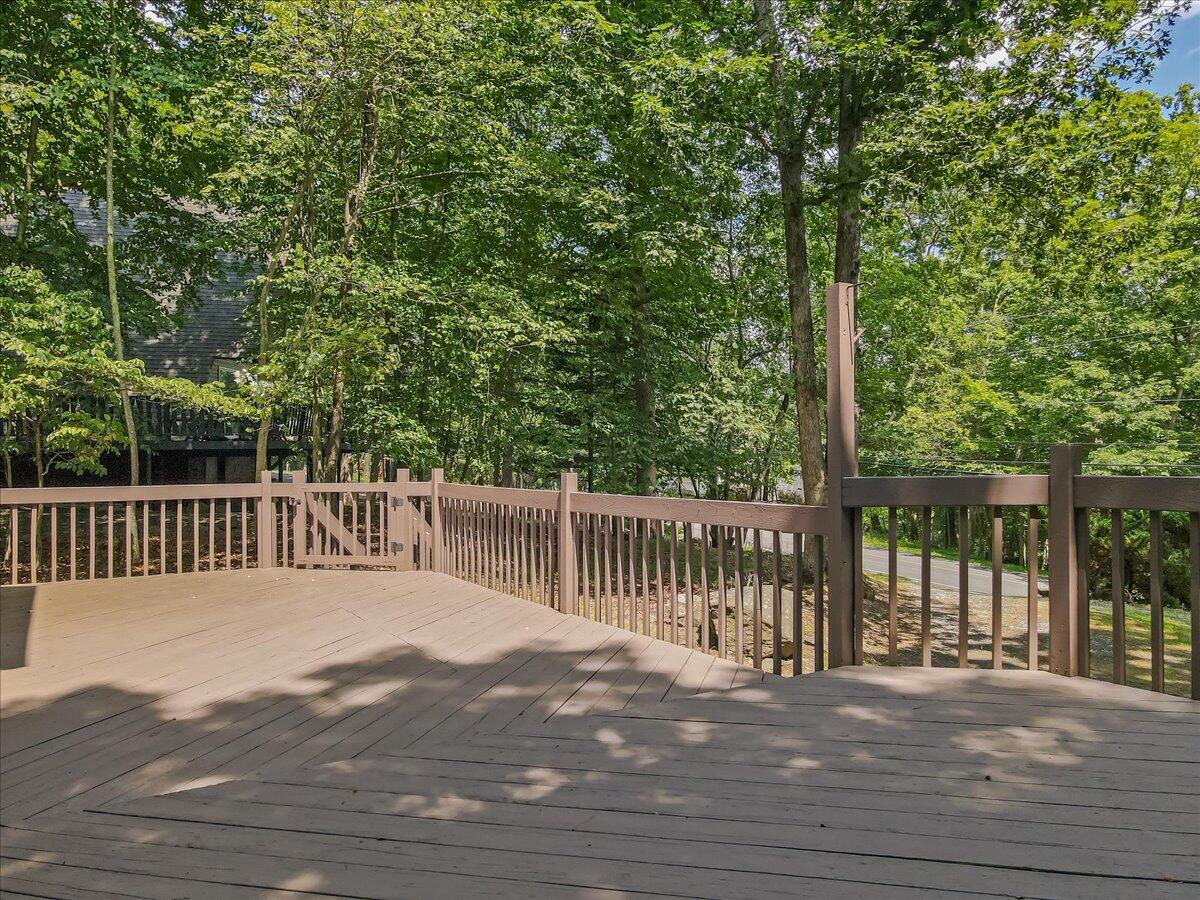 5913 Decker Road Bushkill, PA 18324 - Photo 41 of 53 a view of balcony with wooden floor and fence