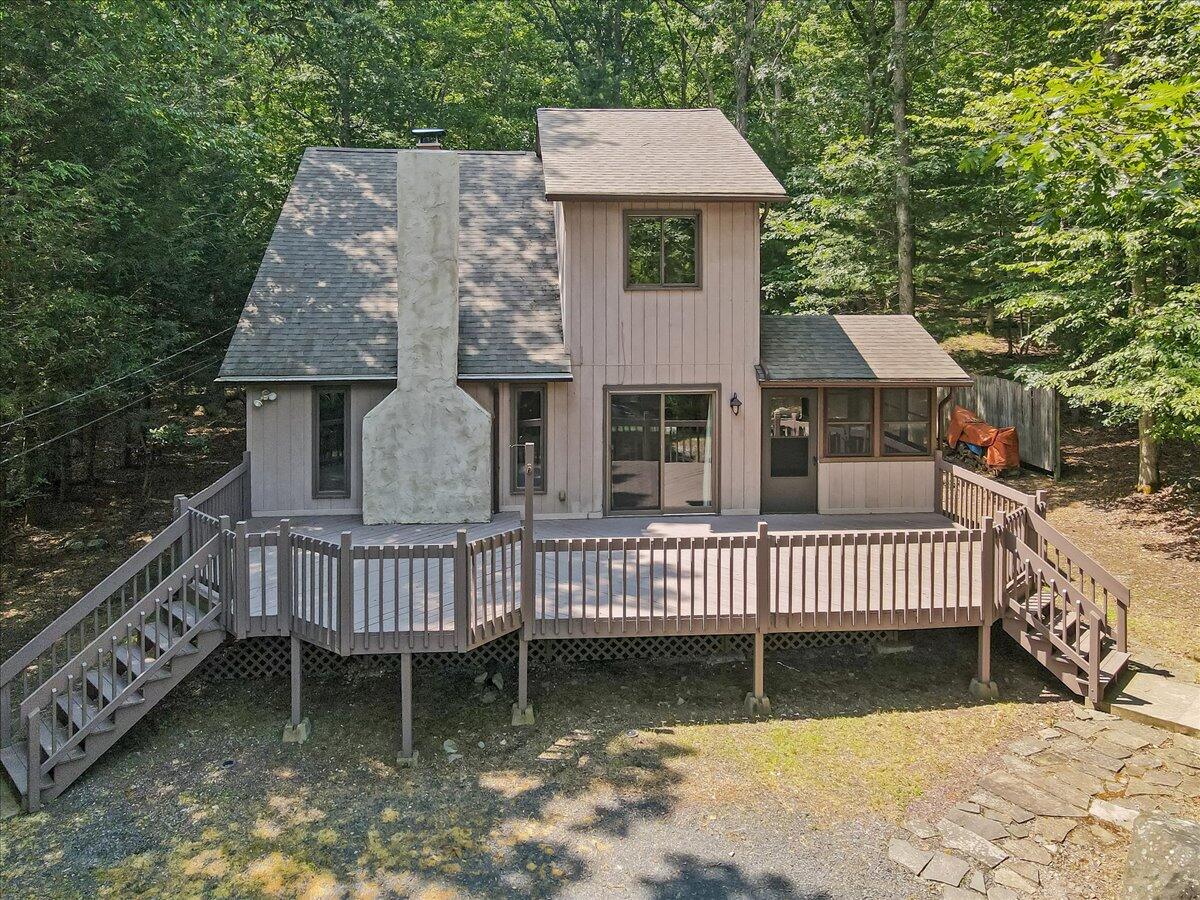 5913 Decker Road Bushkill, PA 18324 - Photo 6 of 53 a front view of a house with a garden