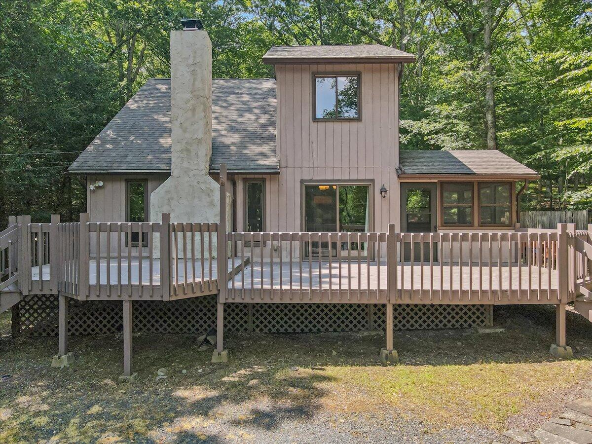 5913 Decker Road Bushkill, PA 18324 - Photo 7 of 53 a view of a house with a deck