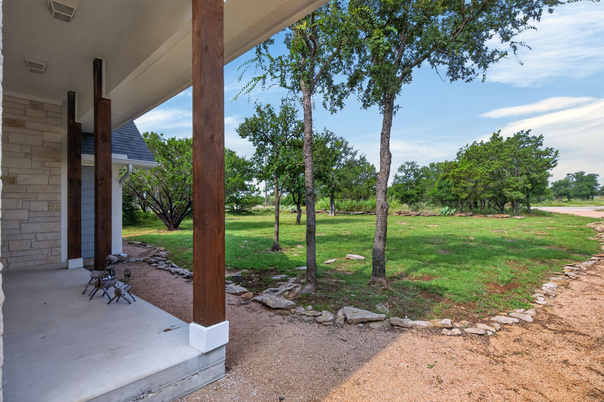 207 Deer Ridge Drive Burnet, TX 78611 - Photo 4 of 36 A welcoming front porch, accented by sturdy wood columns.