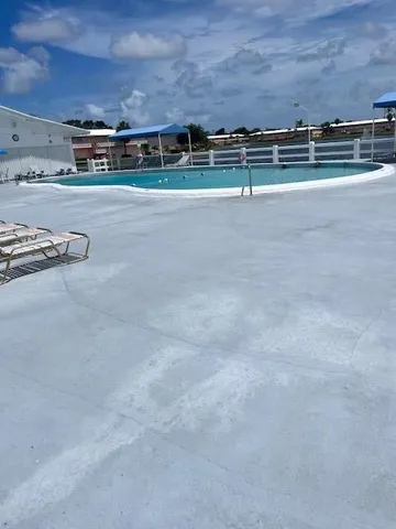 a view of a big room with lots of green space
