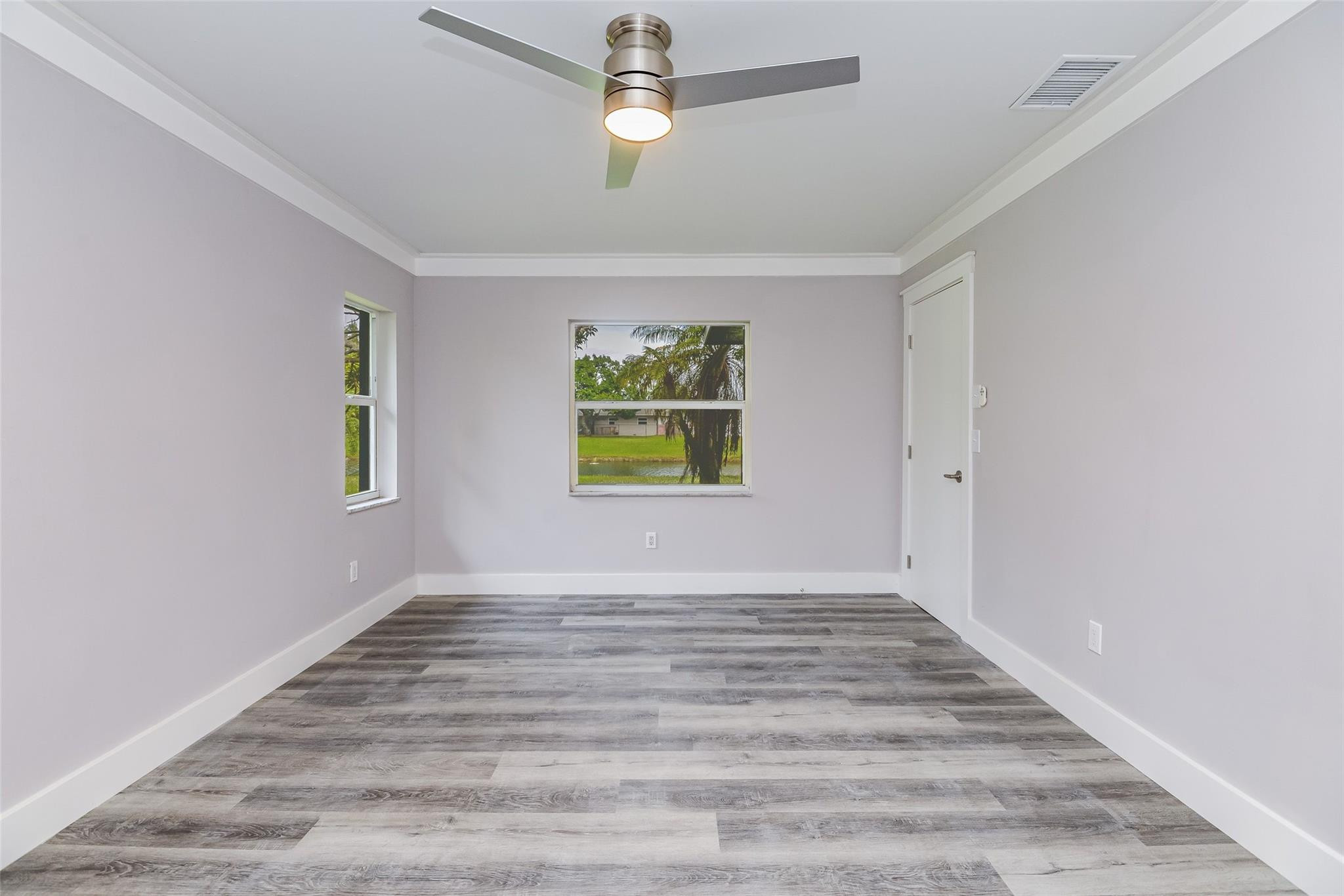 22500 Labrador Street Boca Raton, FL 33428 - Photo 19 of 30 wooden floor in an empty room with a window
