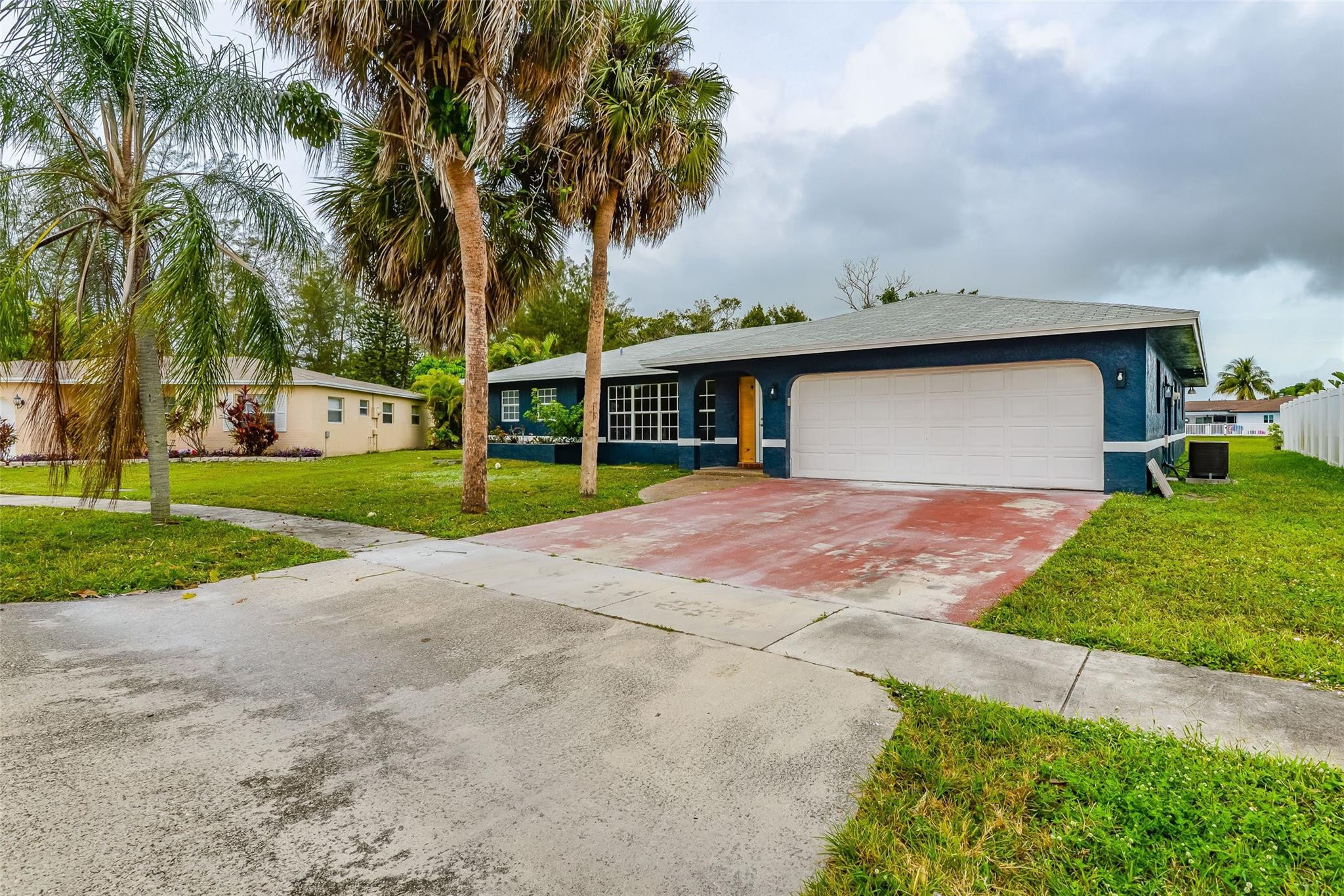 22500 Labrador Street Boca Raton, FL 33428 - Photo 2 of 30 a front view of a house with garden and trees