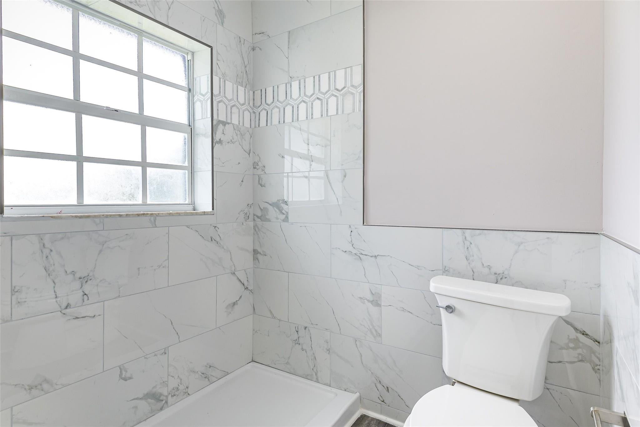 22500 Labrador Street Boca Raton, FL 33428 - Photo 22 of 30 a white toilet sitting next to a bathroom sink