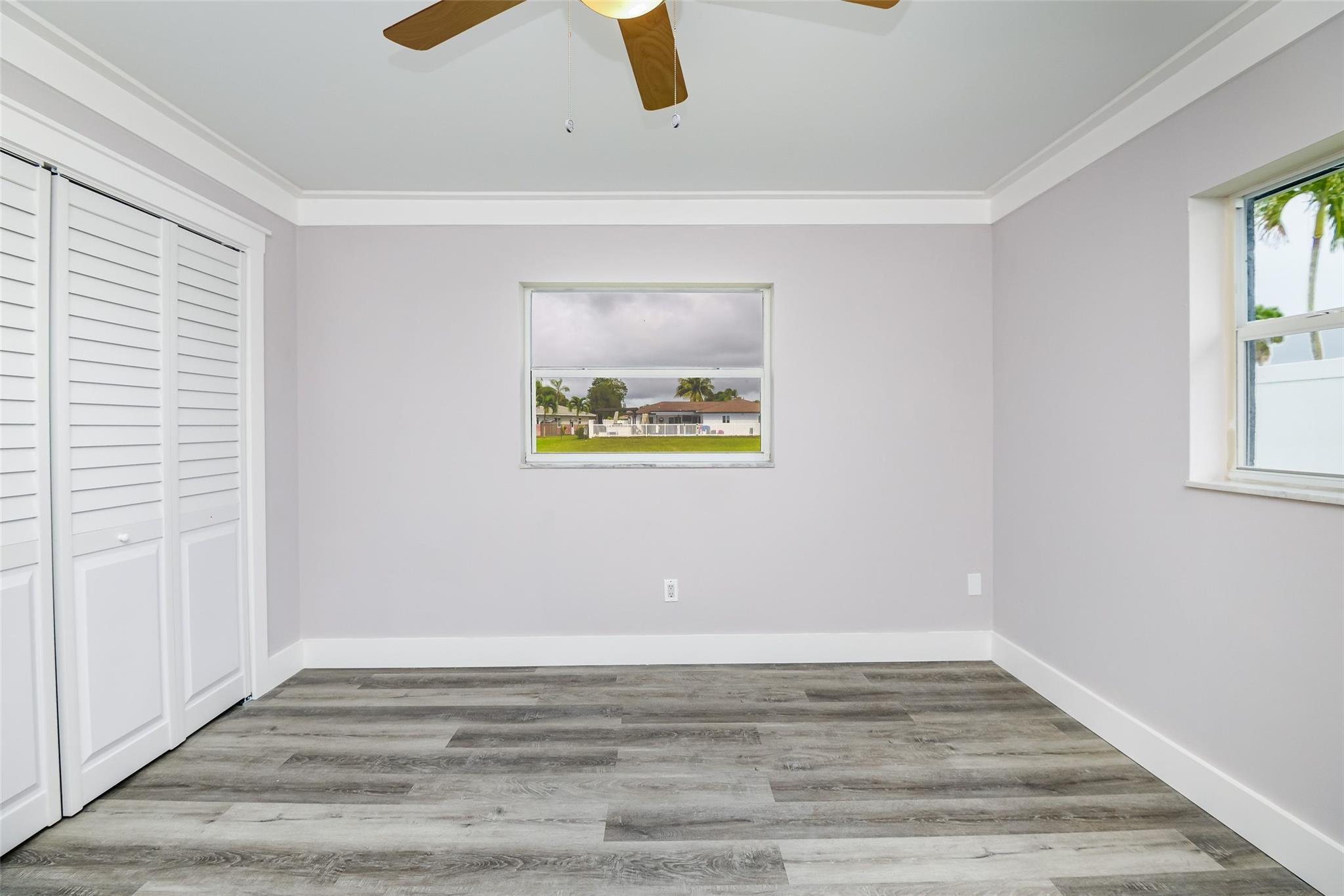 22500 Labrador Street Boca Raton, FL 33428 - Photo 26 of 30 a view of an empty room with window and wooden floor