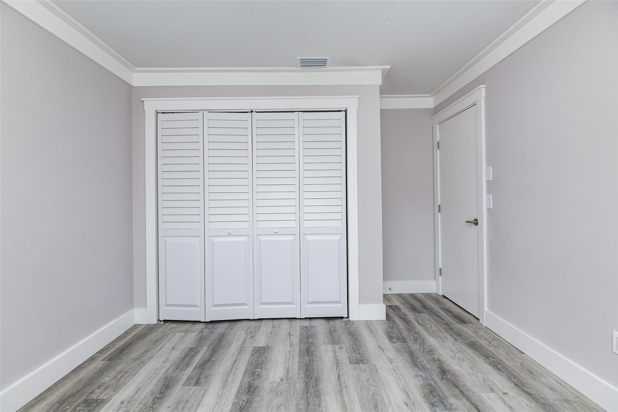 22500 Labrador Street Boca Raton, FL 33428 - Photo 29 of 30 a view of an empty room with wooden floor and a window