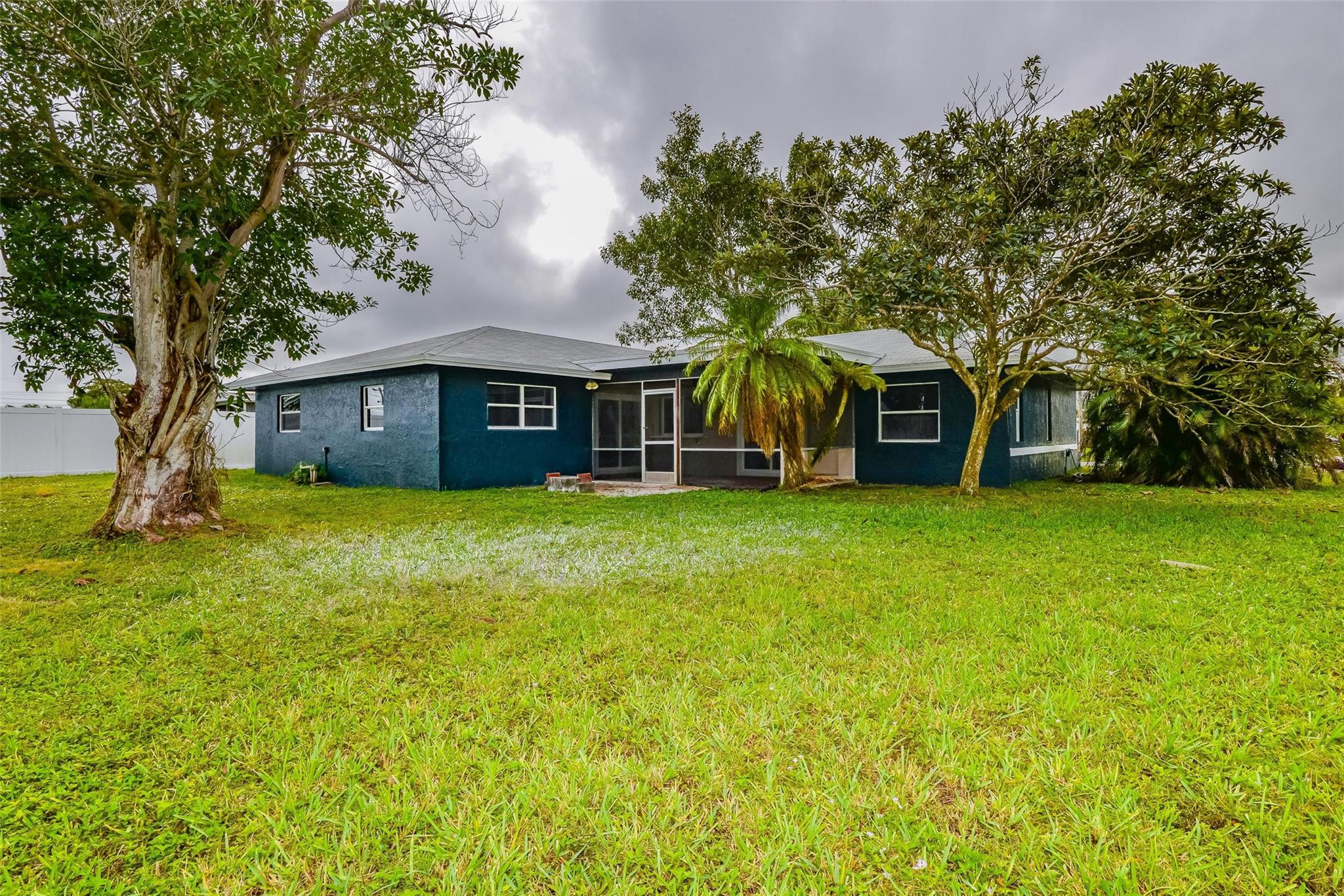 22500 Labrador Street Boca Raton, FL 33428 - Photo 5 of 30 a front view of a house with garden