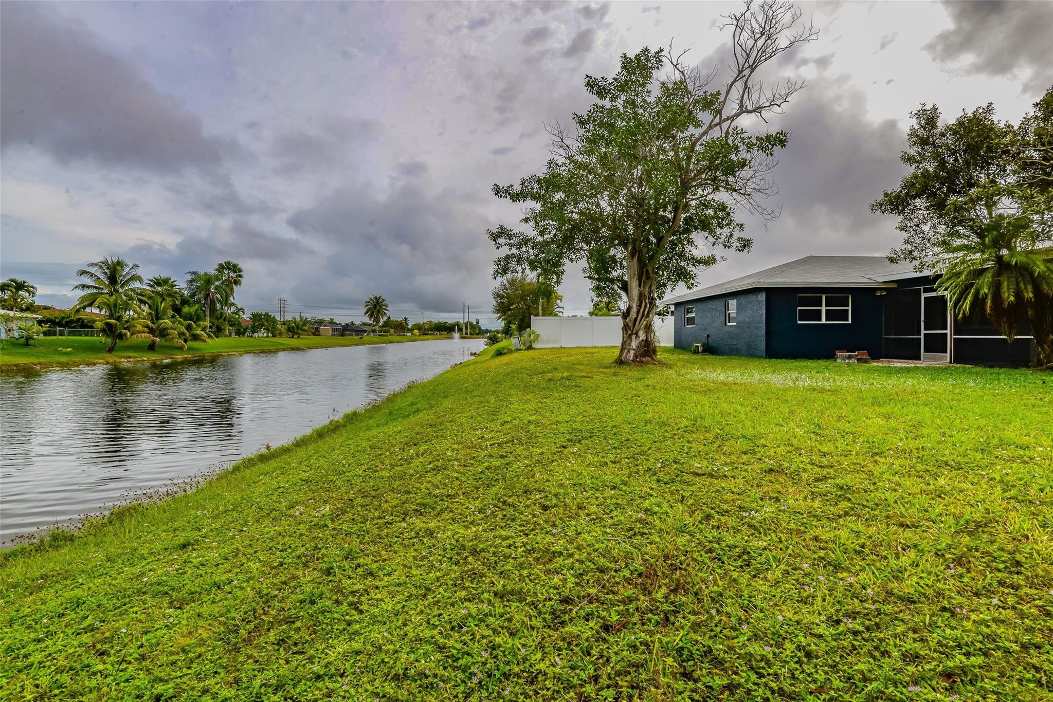 22500 Labrador Street Boca Raton, FL 33428 - Photo 7 of 30 a view of a lake with a house in the background