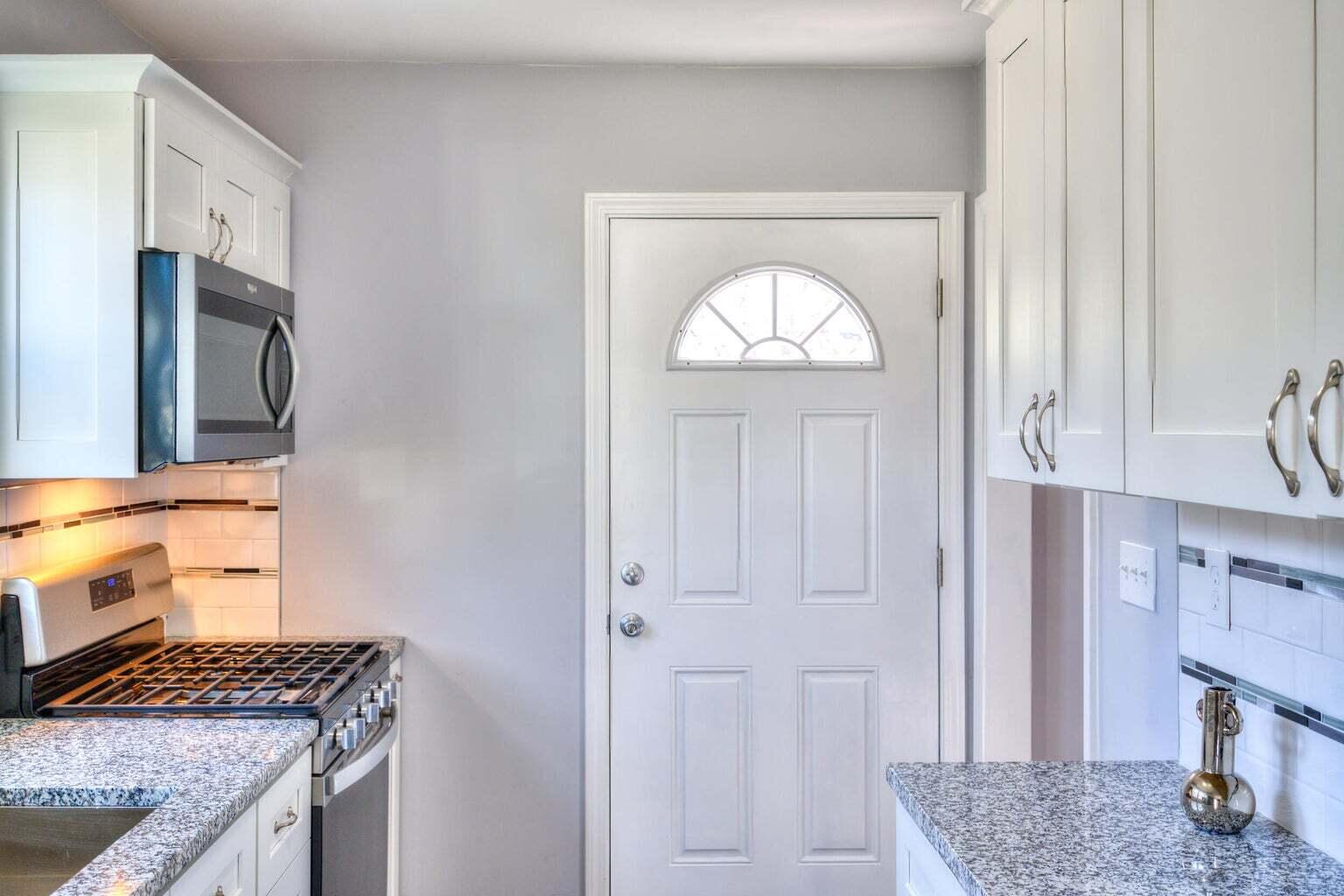 1330 Taney Place Gary, IN 46404 - Photo 8 of 19 a kitchen with stainless steel appliances granite countertop a stove a sink and a refrigerator
