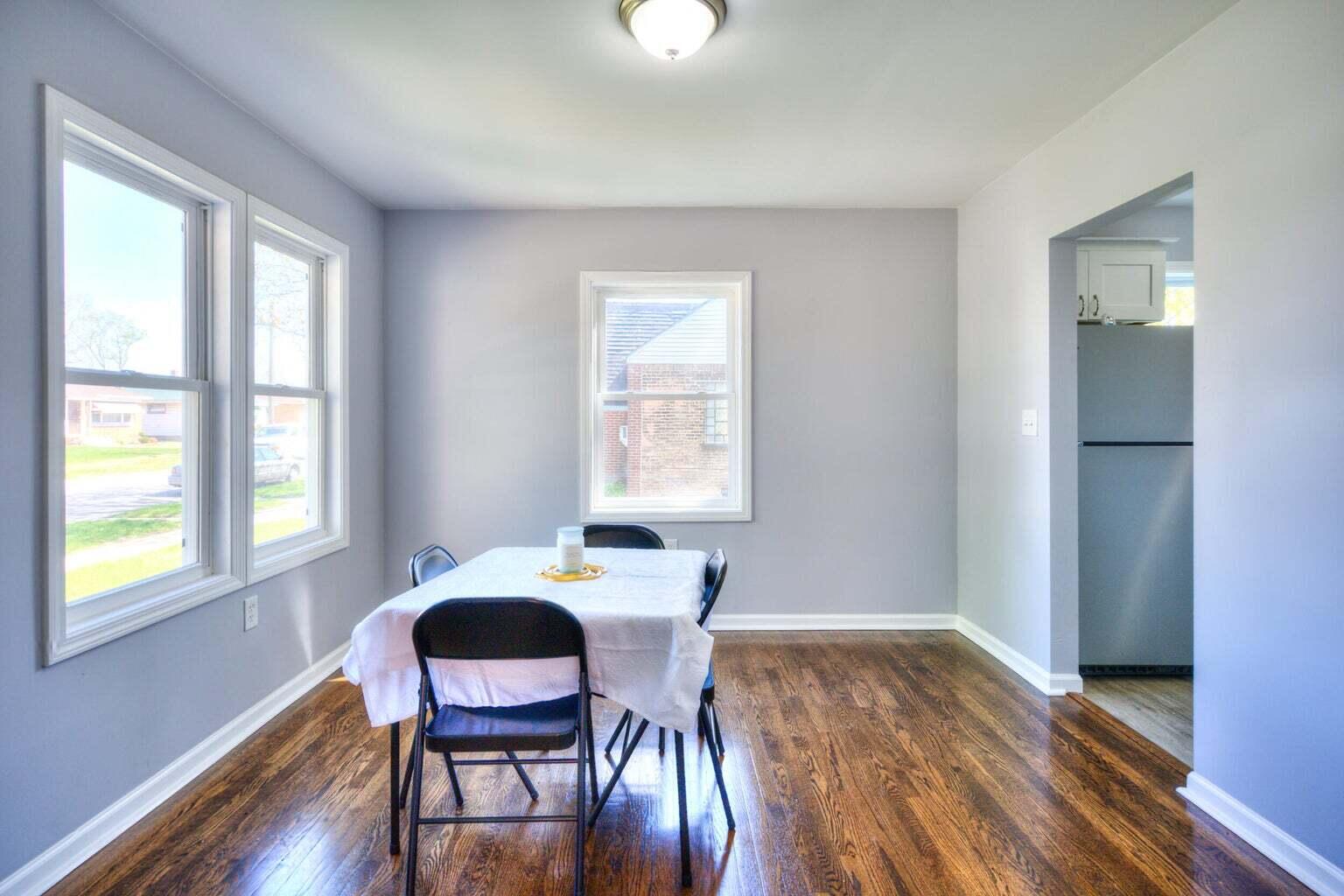 1330 Taney Place Gary, IN 46404 - Photo 9 of 19 a view of a dining room with furniture and wooden floor