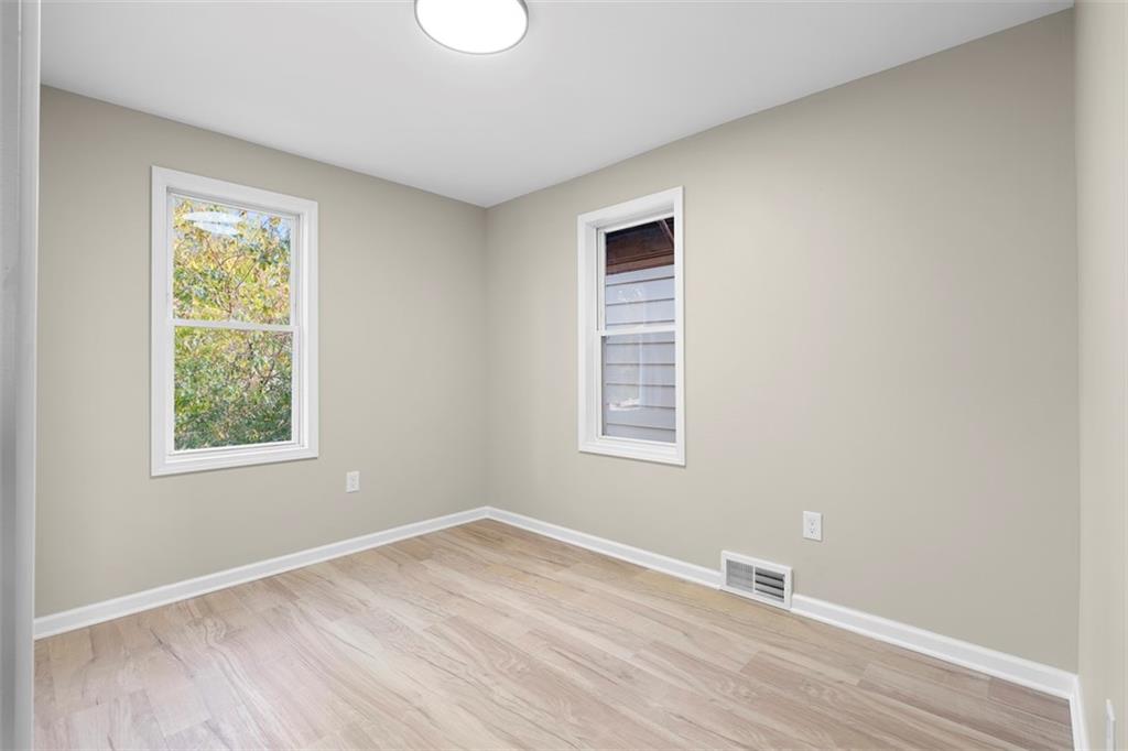 411 Kambach Street Pittsburgh, PA 15211 - Photo 25 of 47 Spacious 2nd Bedroom features high ceilings, excellent natural light, LPV flooring, and large closet!