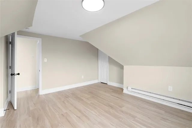 an empty room with wooden floor