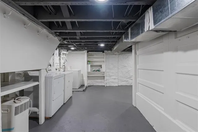 a view of a chairs and table on the wooden deck