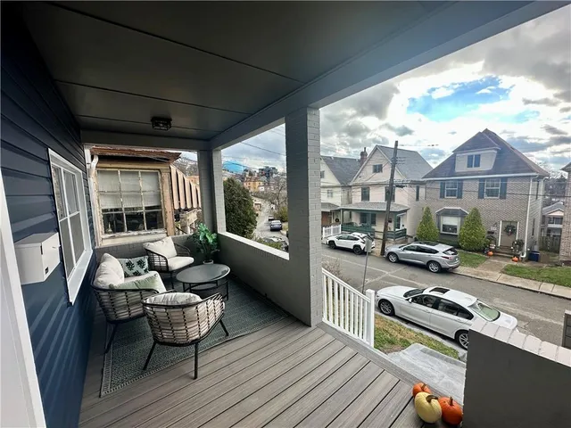 a living room filled with furniture and a table