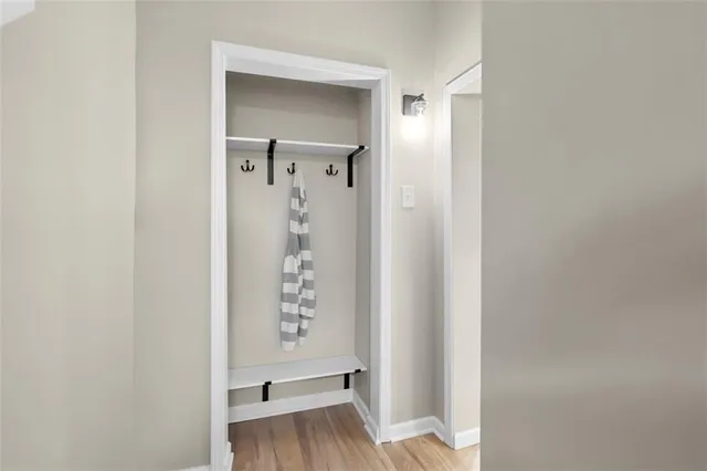 a view of room with furniture and wooden floor