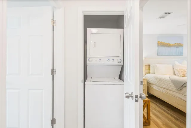 a hallway with a washer and dryer