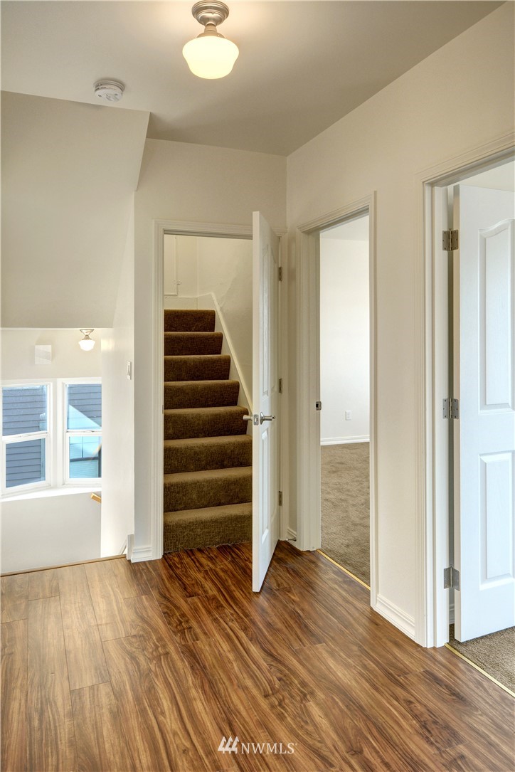 834 15th Avenue Seattle, WA 98122 - Photo 13 of 23 a view of wooden floor and windows in a room