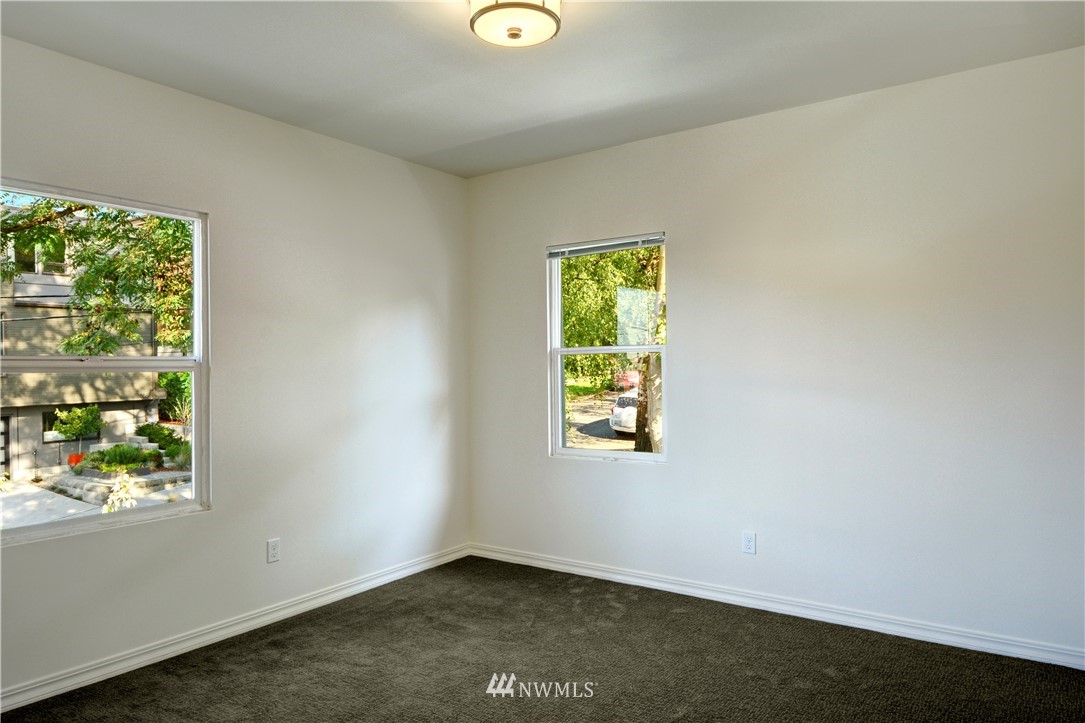 834 15th Avenue Seattle, WA 98122 - Photo 14 of 23 an empty room with windows