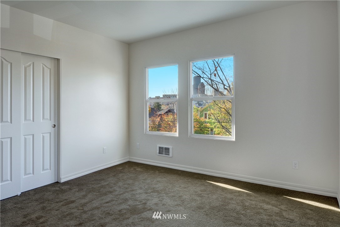 834 15th Avenue Seattle, WA 98122 - Photo 17 of 23 an empty room with windows