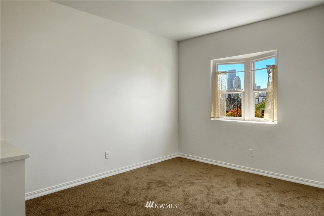 834 15th Avenue Seattle, WA 98122 - Photo 18 of 23 an empty room with a window