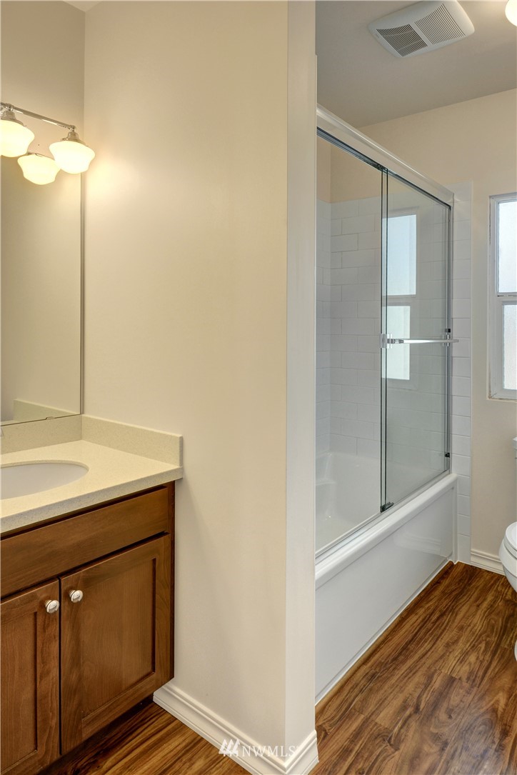 834 15th Avenue Seattle, WA 98122 - Photo 20 of 23 a bathroom with a sink and a mirror