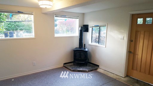 834 15th Avenue Seattle, WA 98122 - Photo 21 of 23 a room with a window and potted plant