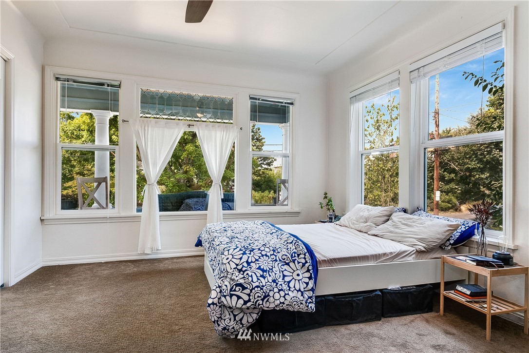 834 15th Avenue Seattle, WA 98122 - Photo 8 of 23 a bedroom with a bed and a window