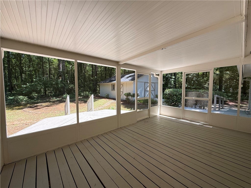306 Crawford Road Opelika, AL 36804 - Photo 22 of 31 This inviting screened porch provides a tranquil connection to the expansive outdoor landscape.