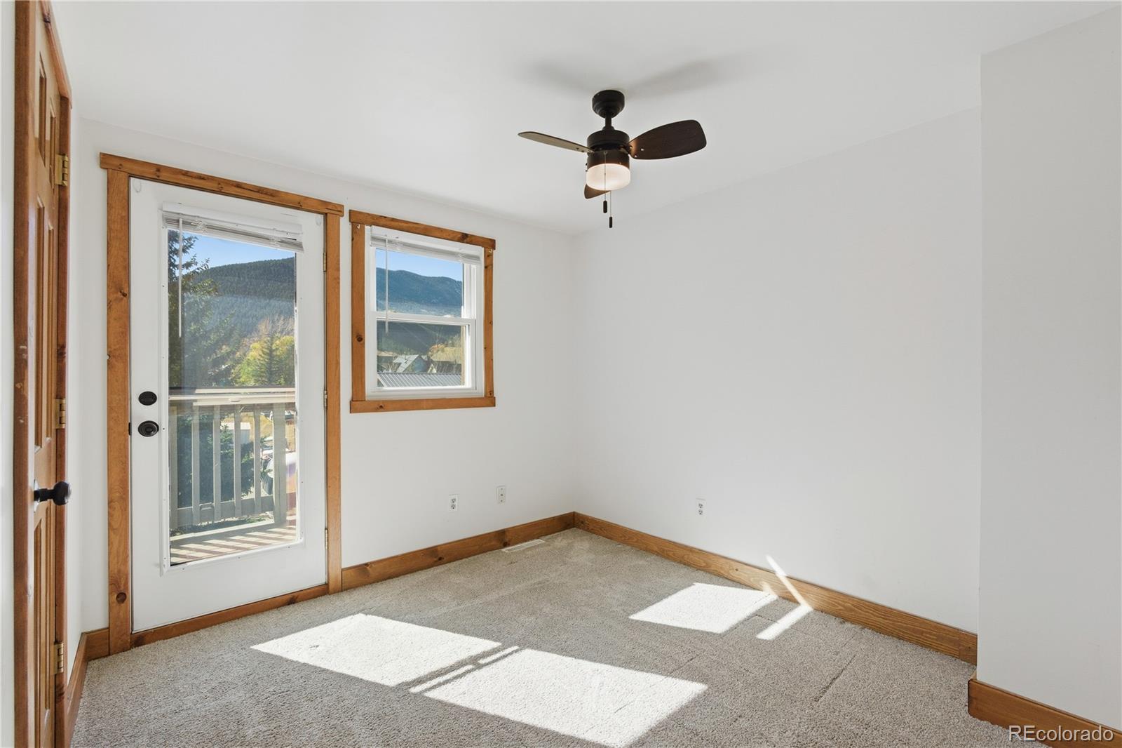 1463 Main Street Georgetown, CO 80444 - Photo 23 of 47 a view of empty room with windows