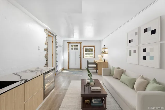 a bedroom with furniture and a chandelier