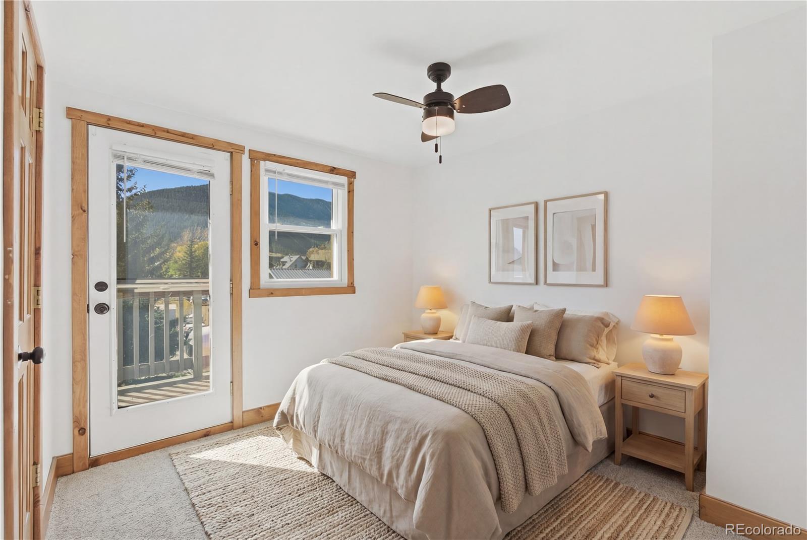 1463 Main Street Georgetown, CO 80444 - Photo 4 of 47 a bedroom with a large bed and a window
