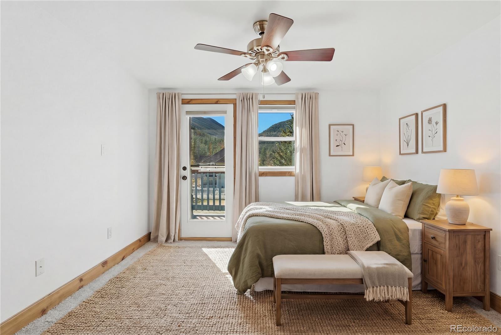 1463 Main Street Georgetown, CO 80444 - Photo 5 of 47 a bedroom with a bed and a large window