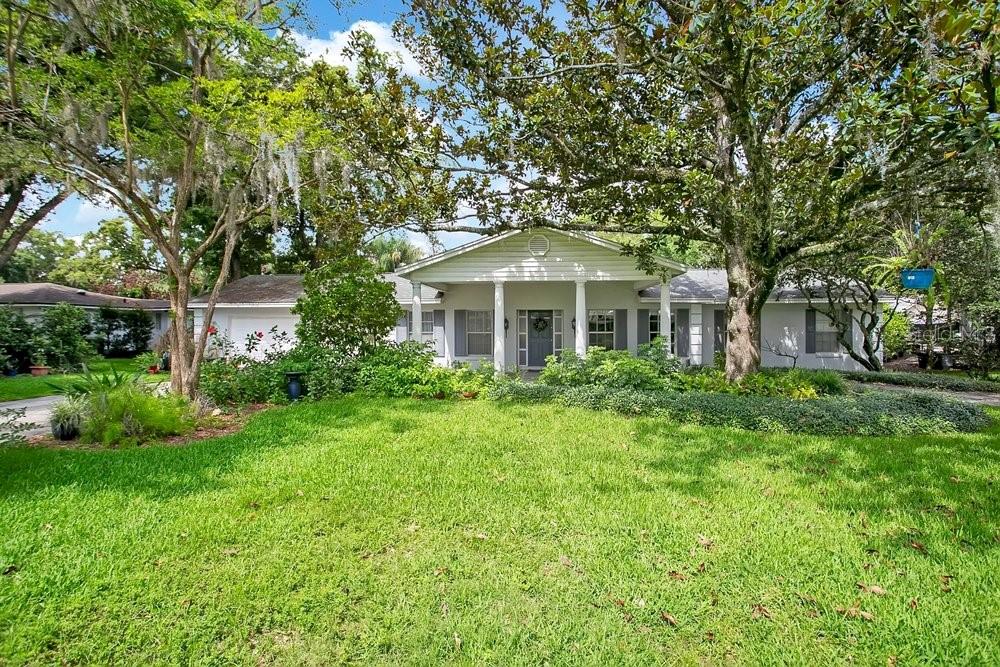412 Forest Street Windermere, FL 34786 - Photo 1 of 34 a front view of a house with a yard