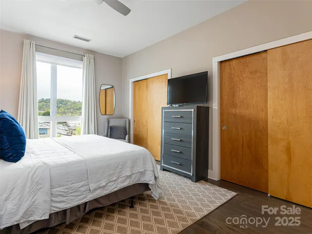 a bedroom with a bed and a dresser