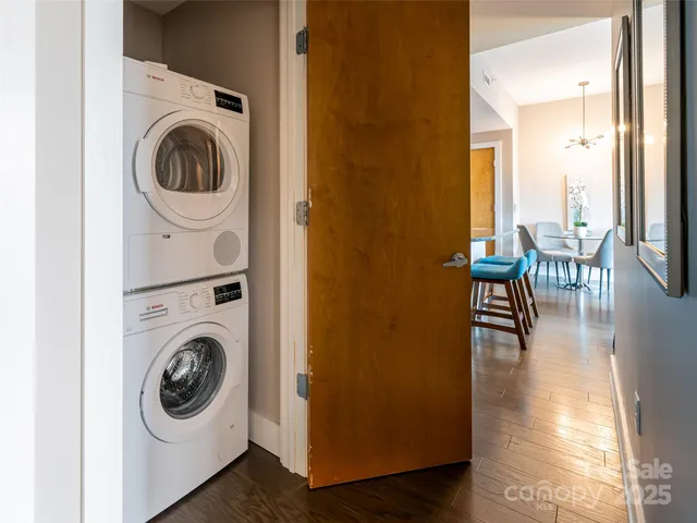a view of a hallway with washer and dryer
