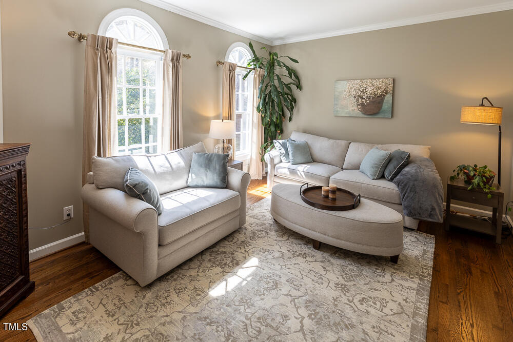 5924 North Hawthorne Way Raleigh, NC 27613 - Photo 16 of 45 a living room with furniture and a large window