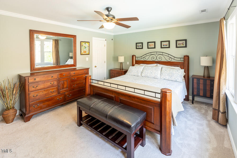 5924 North Hawthorne Way Raleigh, NC 27613 - Photo 22 of 45 a bedroom with a bed and a dresser