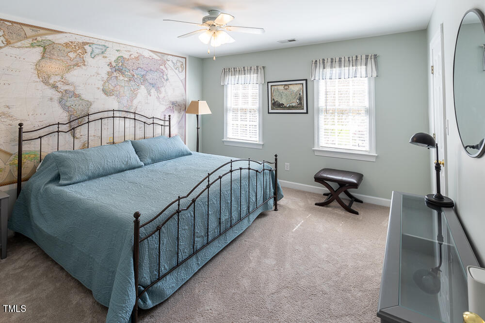 5924 North Hawthorne Way Raleigh, NC 27613 - Photo 26 of 45 a bedroom with a bed and a window