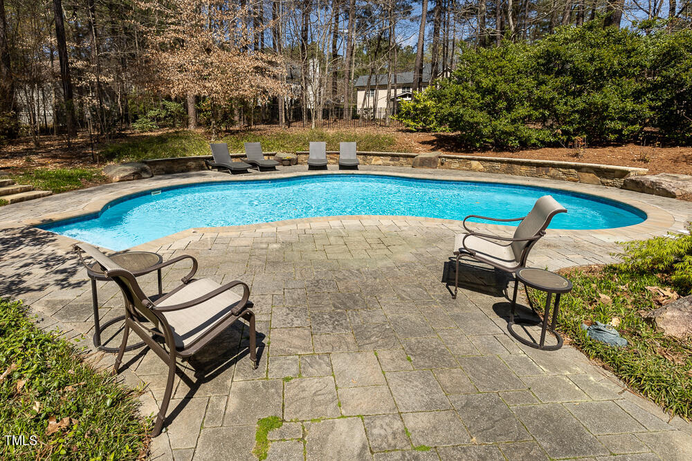 5924 North Hawthorne Way Raleigh, NC 27613 - Photo 37 of 45 a view of a swimming pool with lounge chair