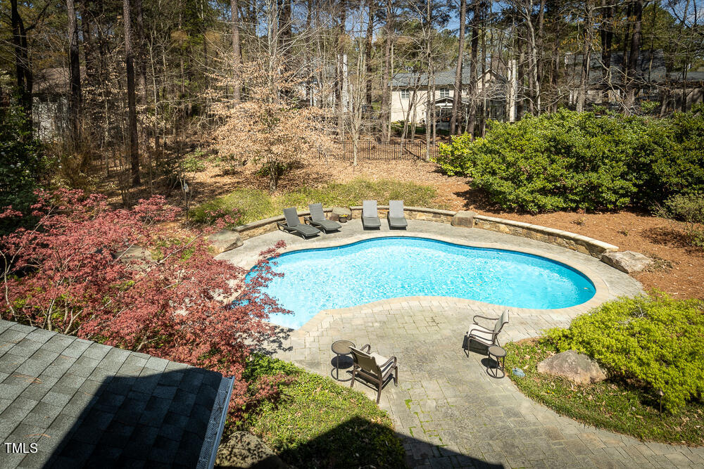 5924 North Hawthorne Way Raleigh, NC 27613 - Photo 43 of 45 a view of a swimming pool with a yard