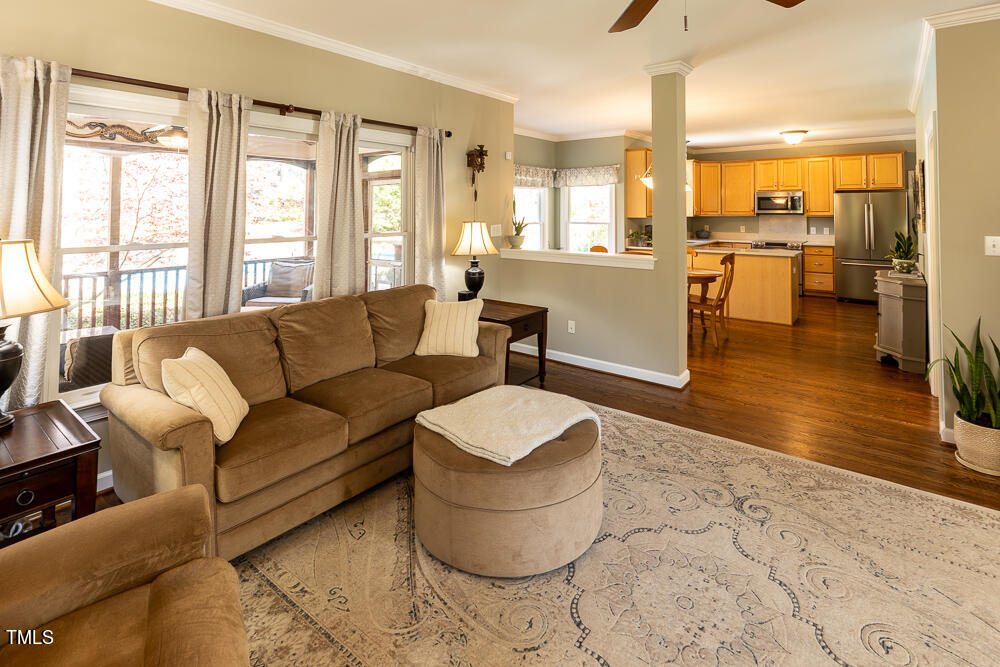 5924 North Hawthorne Way Raleigh, NC 27613 - Photo 8 of 45 a living room with furniture and a large window