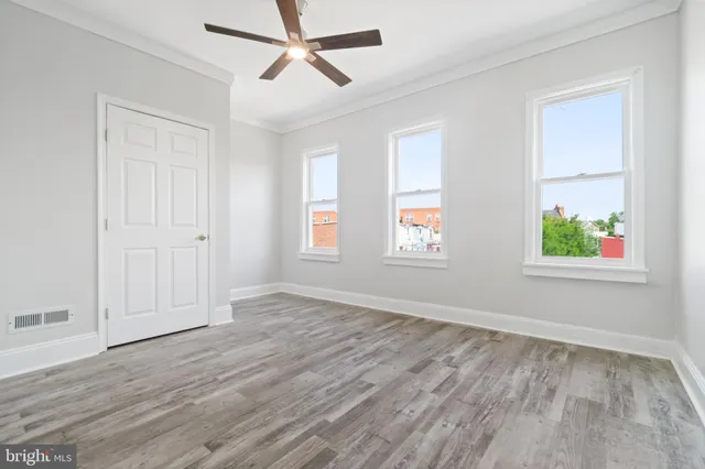 a bathroom with a toilet and shower