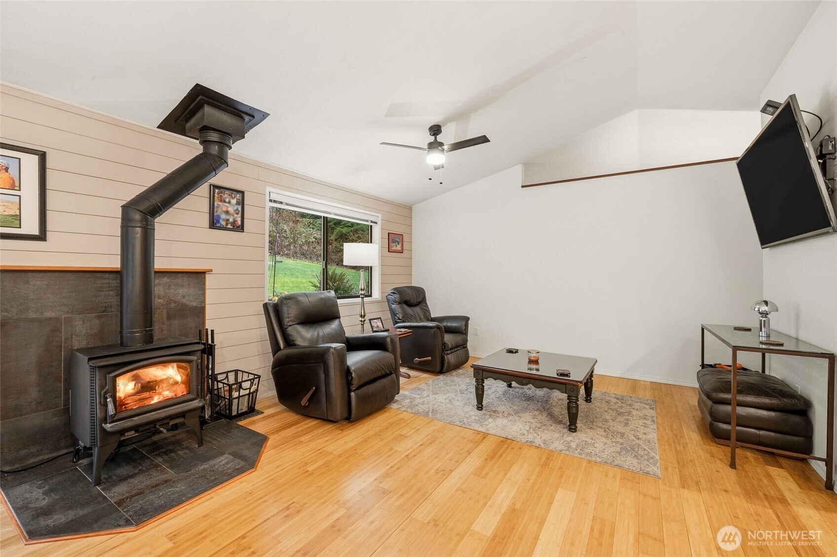 6830 Norma Beach Road Edmonds, WA 98026 - Photo 5 of 30 a living room with furniture and a flat screen tv
