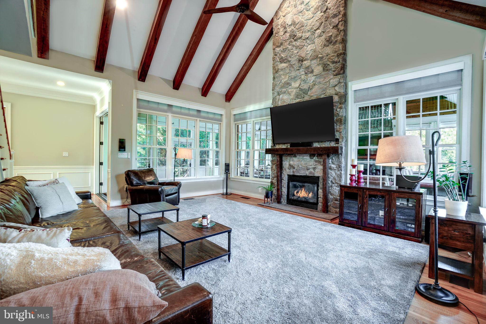 20872 Eckbo Drive Leesburg, VA 20175 - Photo 10 of 96 floor to ceiling stone mantle and gas fireplace