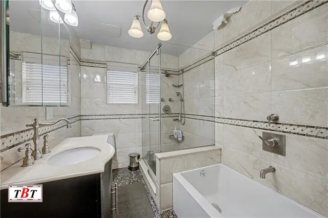 a bathroom with a sink a mirror and a bathtub