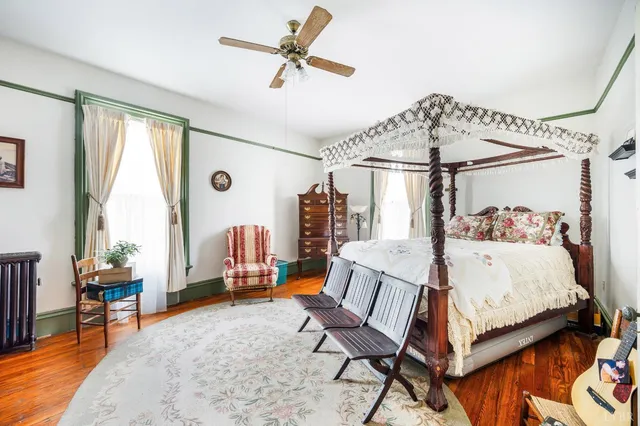 a view of a white house with a yard