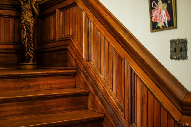 a living room with furniture a rug and a chandelier