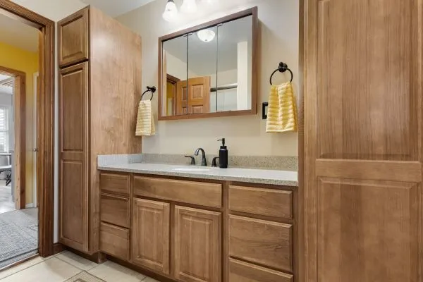 a bathroom with a shower sink and mirror