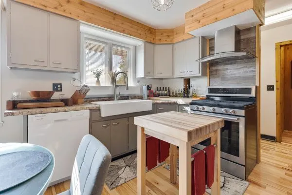 a kitchen with a stove a sink and a refrigerator